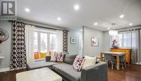 Toronto (Rouge) apartment for rent - A living room with a grey couch and a wooden table.