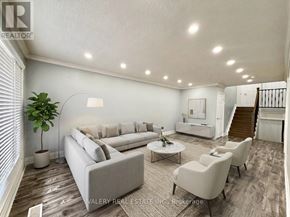 Brampton (Brampton North) apartment for rent - A two-story house with a balcony and a garage door.