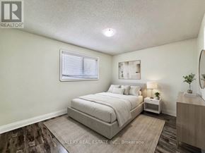 Brampton (Brampton North) apartment for rent - A kitchen with a refrigerator, oven, and sink.