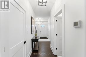 Welland (Lincoln/Crowland) apartment for rent - A hallway with a table and chairs in the middle.
