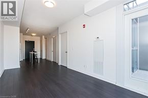 Burlington condo for rent - A long hallway with a table and chairs in the middle.