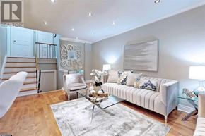 Toronto (Willowdale West) apartment for rent - A living room with a white couch, a glass coffee table, and a staircase.