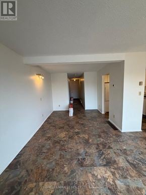 Kingston (West Of Sir John A. Blvd) townhouse for rent - A room with a marble floor and white walls.