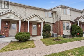 London North (North I) townhouse for rent - A house with a red brick wall and a grey roof.