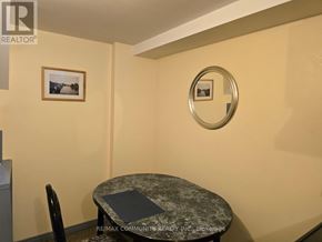 Toronto (Agincourt South-Malvern West) apartment for rent - A small dining room with a round table and a single chair.