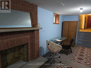 Toronto (Agincourt South-Malvern West) apartment for rent - A room with a fireplace and a desk with a chair.