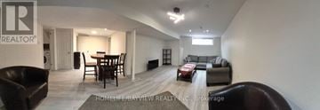 Richmond Hill (Mill Pond) apartment for rent - A living room with a dining table and chairs.