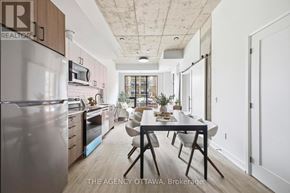 Ottawa condo for rent - A modern kitchen with a dining table and chairs.