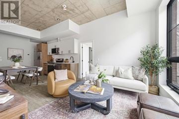 Ottawa condo for rent - A living room with a grey coffee table and a white couch.