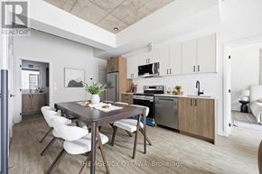 Ottawa condo for rent - A modern kitchen with a dining table and chairs.