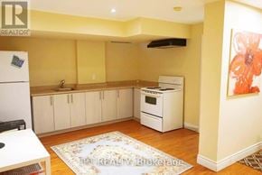 Markham (Victoria Manor-Jennings Gate) apartment for rent - A kitchen with a refrigerator, oven, and cabinets.