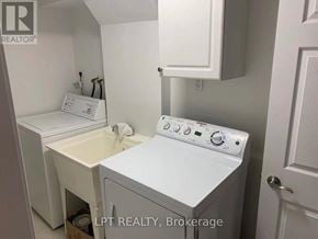 Markham (Victoria Manor-Jennings Gate) apartment for rent - A small white laundry room with a washer and dryer.