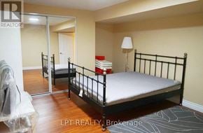 Markham (Victoria Manor-Jennings Gate) apartment for rent - A bedroom with a black metal bed frame and a white mattress.