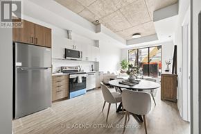 Ottawa condo for rent - A modern kitchen with a dining table and chairs.
