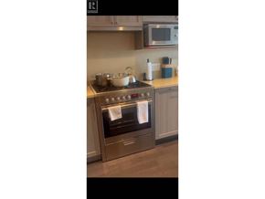 Burnaby apartment for rent - A modern kitchen with a stove and oven.