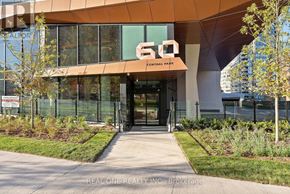 Toronto (Islington-City Centre West) condo for rent - A modern kitchen with wooden cabinets and stainless steel appliances.