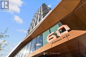 Toronto (Islington-City Centre West) condo for rent - A modern kitchen with wooden cabinets and stainless steel appliances.