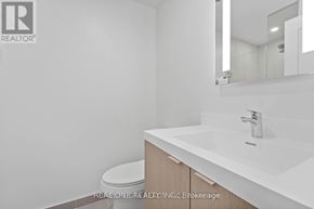 Toronto (Islington-City Centre West) condo for rent - A spacious kitchen with a refrigerator, oven, and microwave.