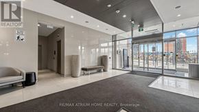 Toronto (Newtonbrook East) condo for rent - A lobby area with a REALTOR sign on the wall.