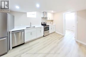 London North (North I) apartment for rent - A modern kitchen with white cabinets and stainless steel appliances.