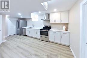 London North (North I) apartment for rent - A clean, modern kitchen with white cabinets and stainless steel appliances.