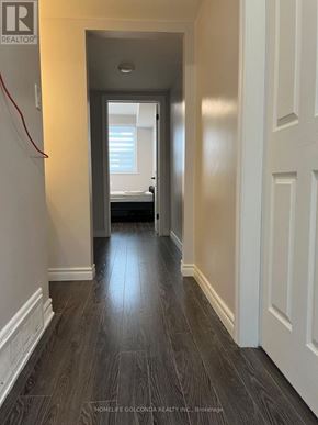Toronto (Willowdale East) apartment for rent - A hallway with wood flooring and white walls.