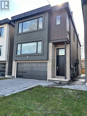 Toronto (Kennedy Park) apartment for rent - A modern two-story house with a garage is for sale.
