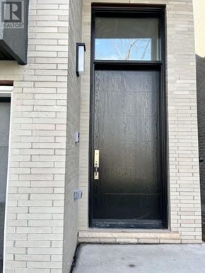 Toronto (Kennedy Park) apartment for rent - A black door with a glass window above it.
