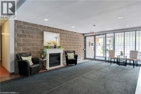 Hamilton condo for rent - A living room with a fireplace and chairs.