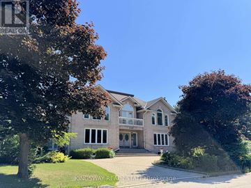 Mississauga (Rathwood) apartment for rent - A large house with a driveway in front of it.