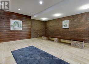 Toronto (Victoria Village) condo for rent - A room with a blue rug and wooden walls.
