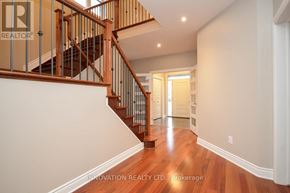 Ottawa apartment for rent - A hallway with a staircase and a doorway.
