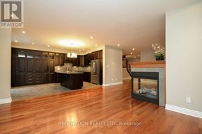 Ottawa apartment for rent - A spacious living room with wood flooring and a fireplace.