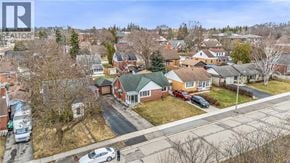 Kitchener apartment for rent - A bird's eye view of a residential neighborhood with houses and parked cars.