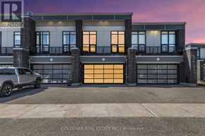 Innisfil townhouse for rent - A modern building with a car parked in front of it.