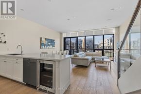 Innisfil townhouse for rent - A modern kitchen with a view of the city.