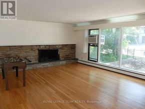Ottawa multi-family for rent - A room with a fireplace and a chessboard.