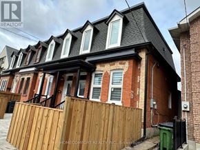 Toronto (Weston-Pellam Park) duplex for rent - A row of houses with a sign that says Home Comfort Realty, Brokerage.