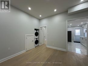 Toronto (Weston-Pellam Park) duplex for rent - A room with a washer and dryer in it.