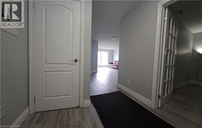 Hamilton condo for rent - A white door with a REALTOR sign on the left side.