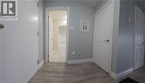 Hamilton condo for rent - A hallway with a door on the left and a door on the right.