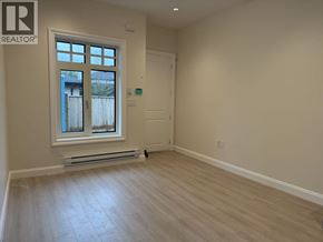Vancouver apartment for rent - A room with a window and a door is for sale.