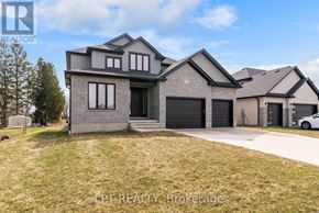 North Middlesex (Parkhill) apartment for rent - A modern house with a grey and black exterior is for sale.
