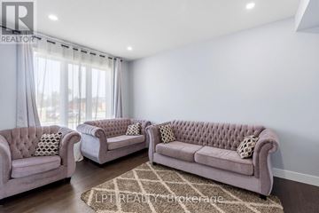 North Middlesex (Parkhill) apartment for rent - A living room with two couches and a rug.