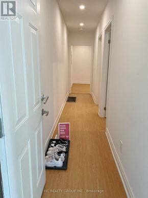 Toronto (Broadview North) apartment for rent - A brochure for a realtor is on the floor of a hallway.