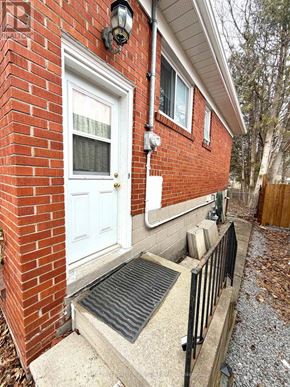 Newmarket (Central Newmarket) apartment for rent - A red brick house with a white door and a black railing.