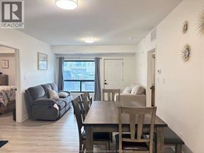 Windsor condo for rent - A well-lit dining area with a wooden table and chairs.