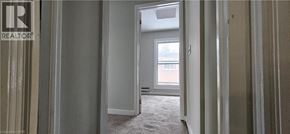 Cambridge apartment for rent - A realtor's office with a doorway leading to a bedroom.
