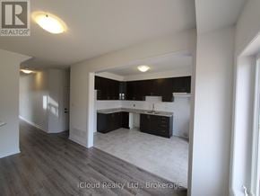 Southgate apartment for rent - A well-lit kitchen area with a dining table and chairs is visible.
