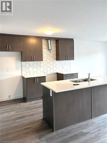 Cambridge townhouse for rent - A kitchen with a white counter top and brown cabinets.